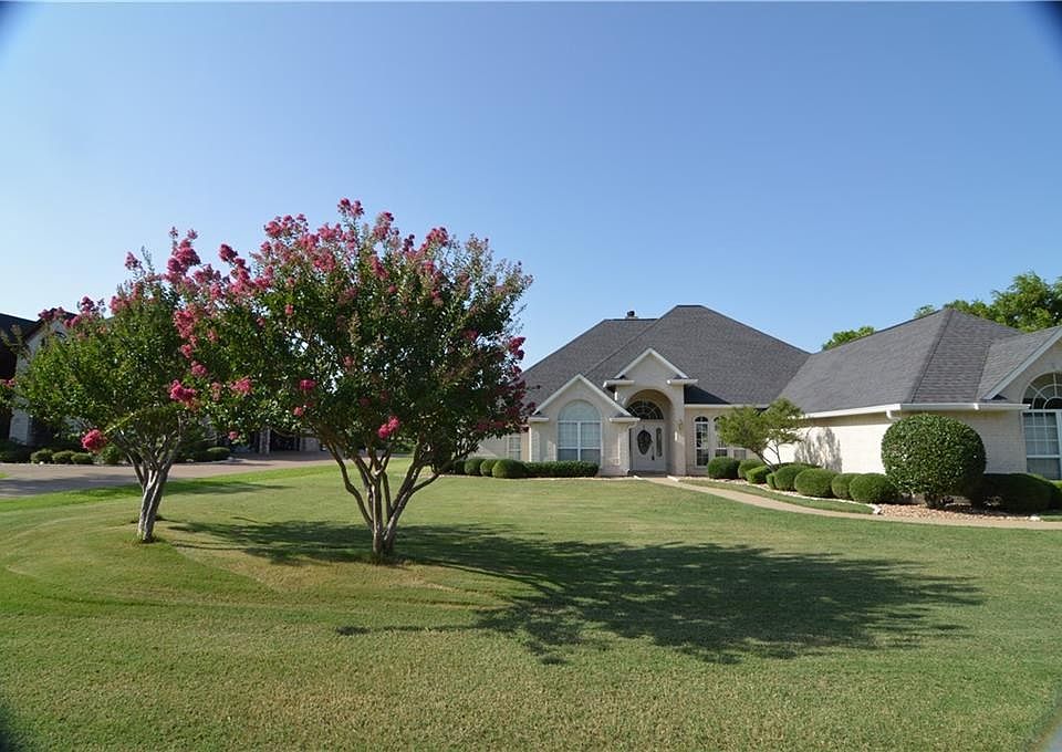 TREES ARE ALL IN BLOOM, LANDSCAPING IS GORGEOUS, HOME IS IMMACULATE INSIDE & OUT!!