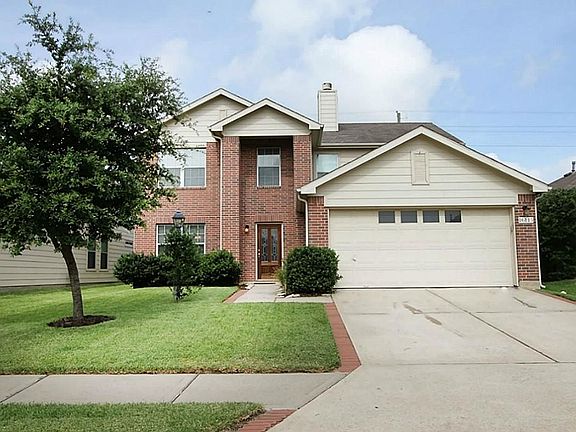 Beautifully landscaped with brick lining the driveway and sidewalk.