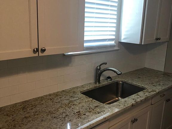 Check out the gorgeous granite! Microwave still in the box. Cute and clean!