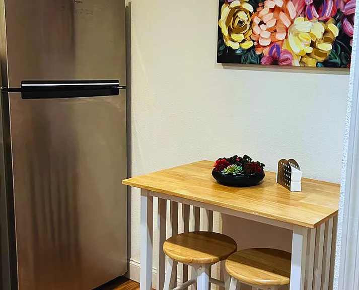 Comfortable dining table with seating, perfect for enjoying your meals.