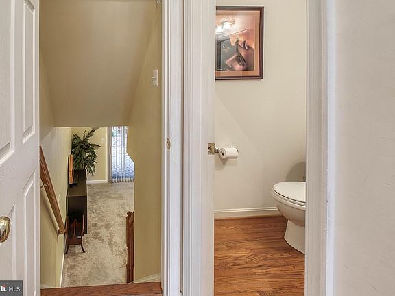 Foyer to Lower Level & Powder Room