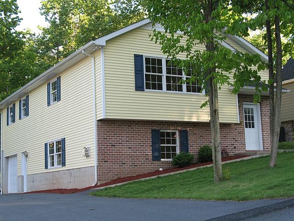 Street veiw with drive and garage