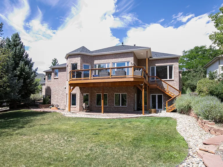 Exterior of back of house includes a walk out basement.