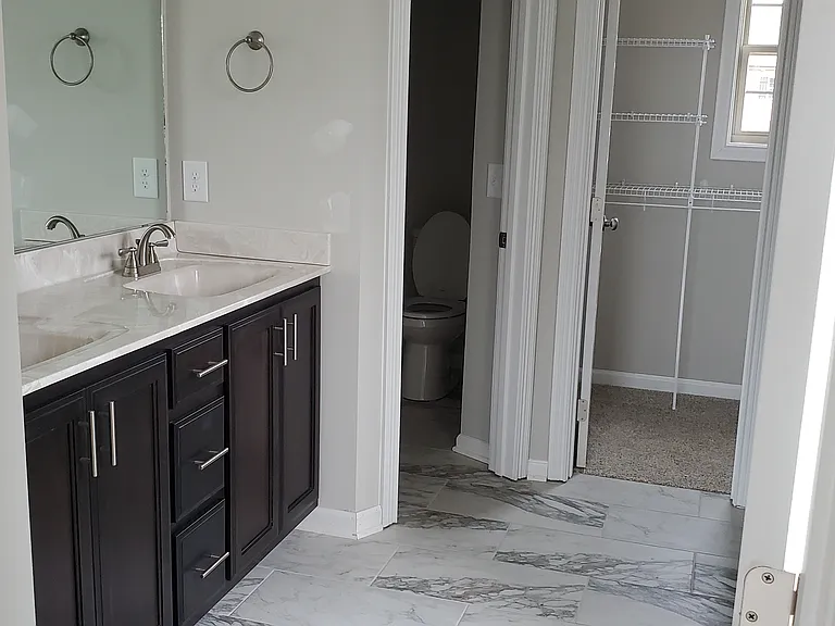 Primary Bedroom Bathroom:
* Double Vanity
* Separate tub and shower
* Private toilet
* 1 of 2 Walk-in Closets
