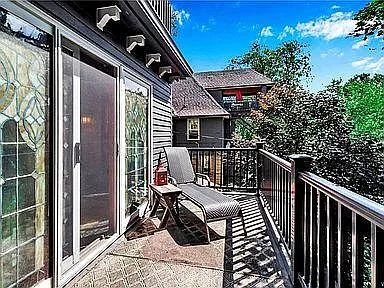 2nd-floor balcony off the exercise room overlooking the back deck and backyard
