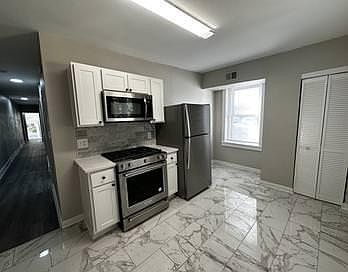 Spacious open kitchen with dining room