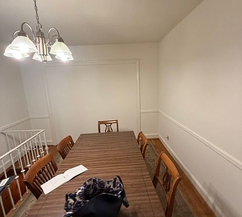 The dining room table can remain for residents' use.