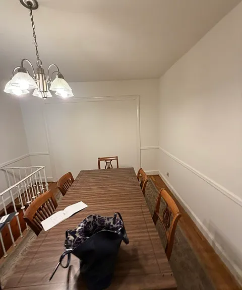 The dining room table can remain for residents' use.