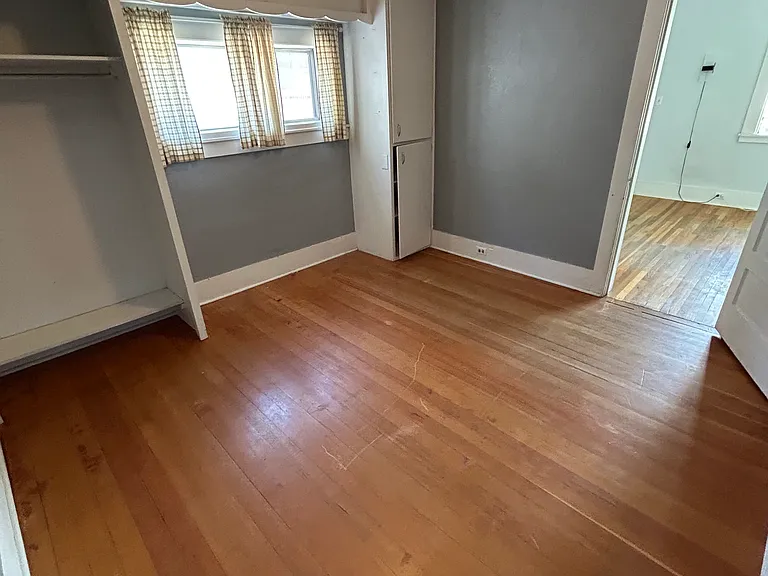 Peek-a-boo! From the bedroom, you get a cozy glimpse into the family room_the heart of the house. It's perfect for keeping an eye on things or just enjoying how the spaces flow. Small home, big vibes, and plenty of room for comfy living.