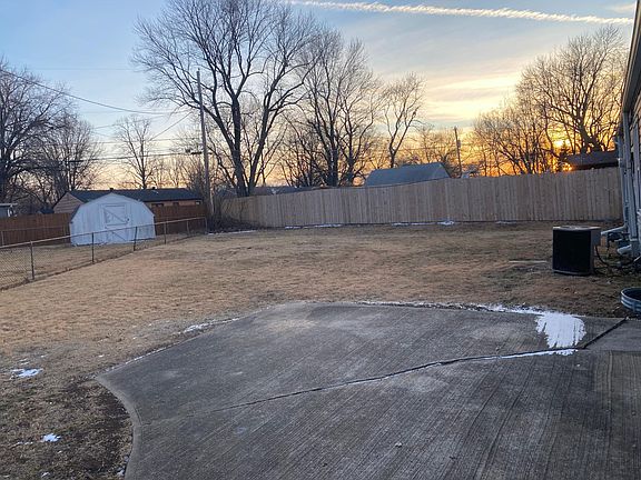 Large fenced in back yard with patio.