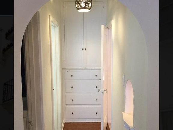 Hallway with Moroccan light fixture.