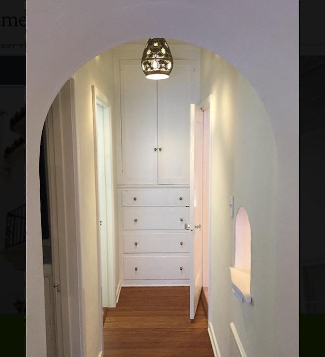 Hallway with Moroccan light fixture.