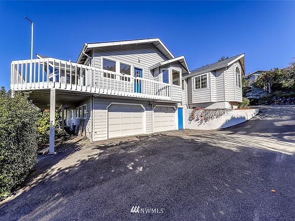 Coming up the driveway, there is an oversized two-car garage on the lower level.  