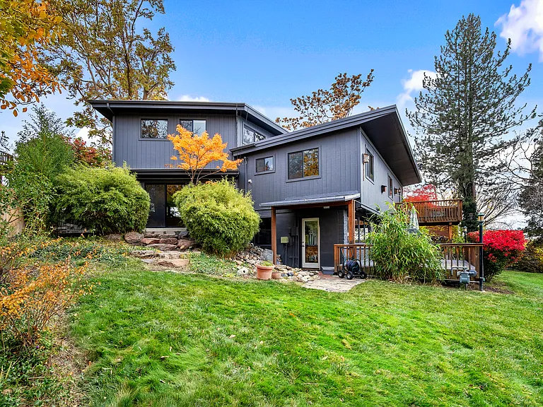 Large landscaped backyard.