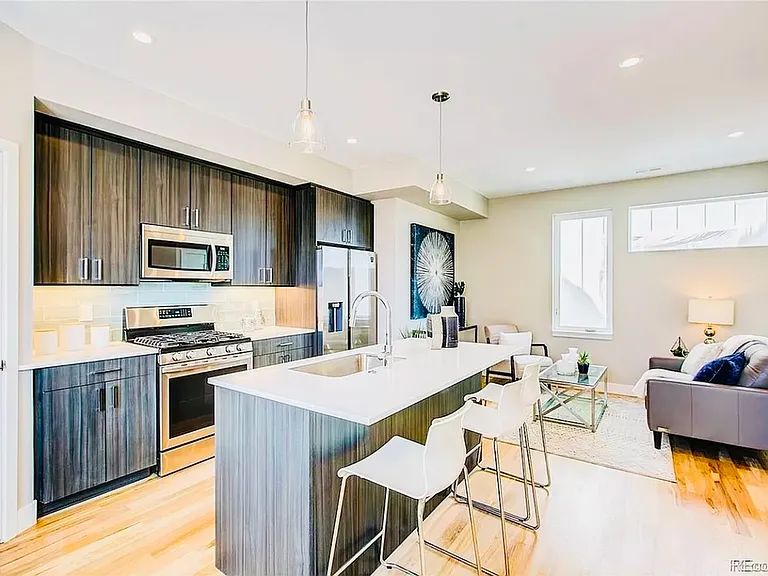 Explore this inviting open-concept kitchen and living space, perfect for modern living. Explore this inviting open-concept kitchen and living space, perfect for modern living.