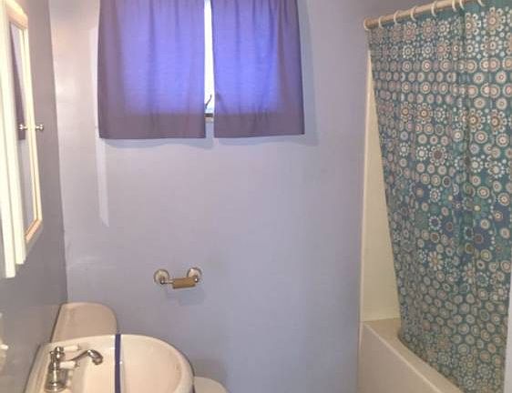 Bathroom with pedistal sink.