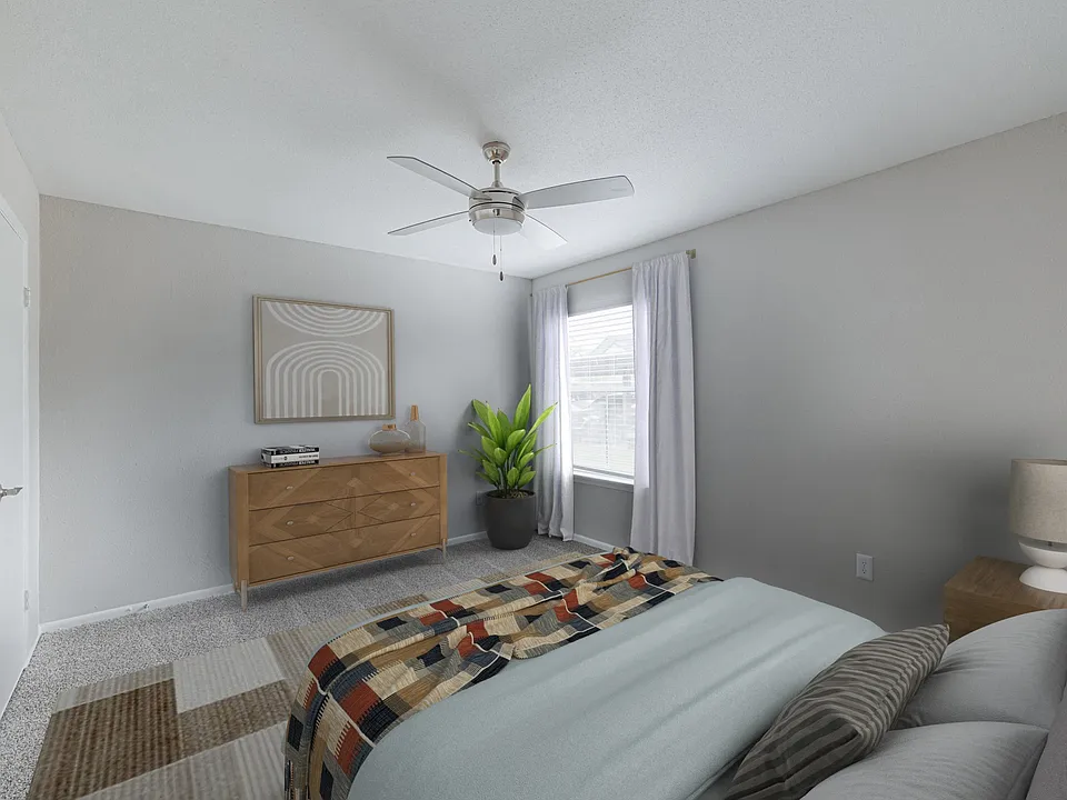 Bedroom with plush carpeting