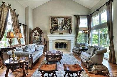 Elegant formal Living room with soaring ceiling, fire place, ver