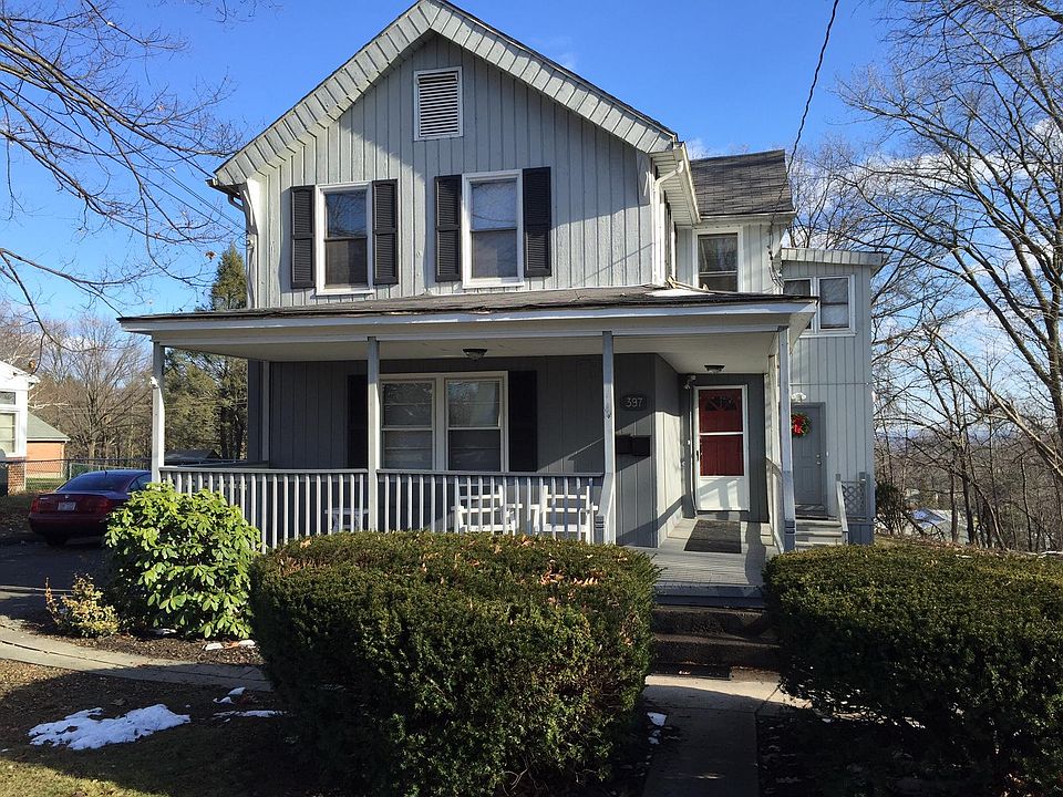 Early 20th century house with two apartments; this listing is for upstairs unit, with entrance located on the far right above with wreath.