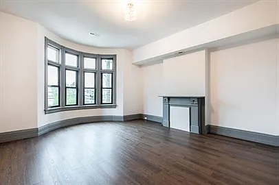 Spacious rooms with luxury vinyl plank flooring, big beautiful newer window and original fireplaces, not working, but great ambiance.