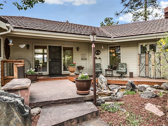 Professionally landscaped with water feature and low voltage lighting   Covered front porch