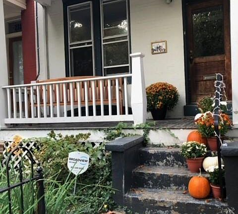 Front porch decorated for fall