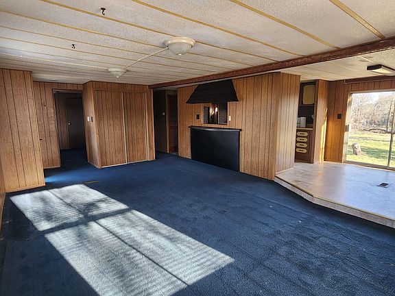 Living room with a double wide coat closet.
