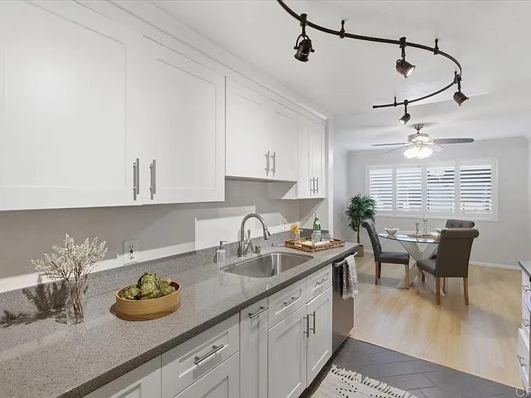 Kitchen with dining area in background.