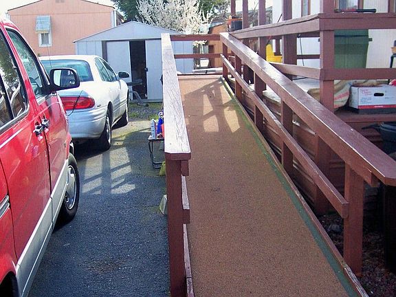 Ramp to front door next to driveway