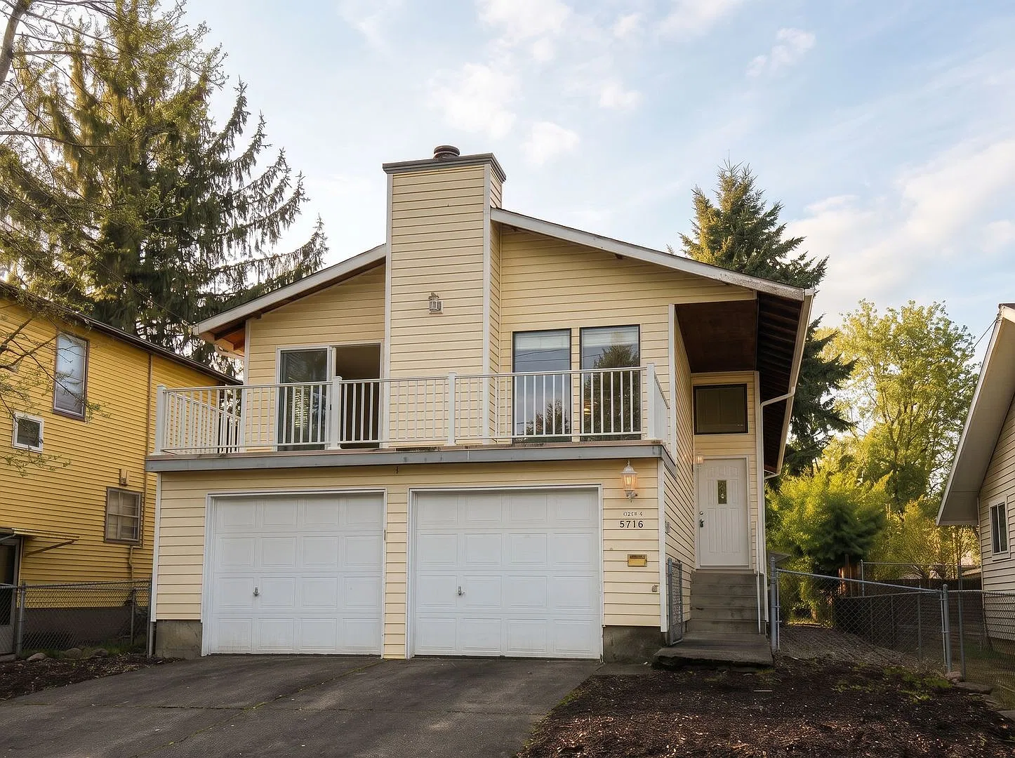 Light-Filled SE Portland Split-Level with 2-Car Garage, Dual Decks & Fenced Yard — Photo 1