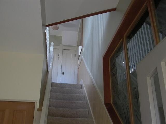 View from 903 front door entry. Door on left provides 903 access to stairs down to basement and washer and dryer.