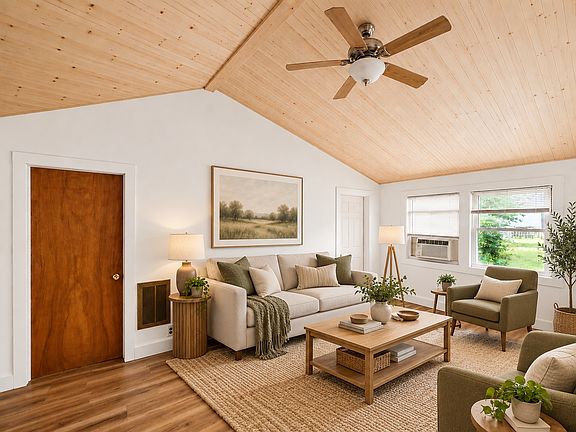 This is a virtually staged picture of what the living room could look like furnished