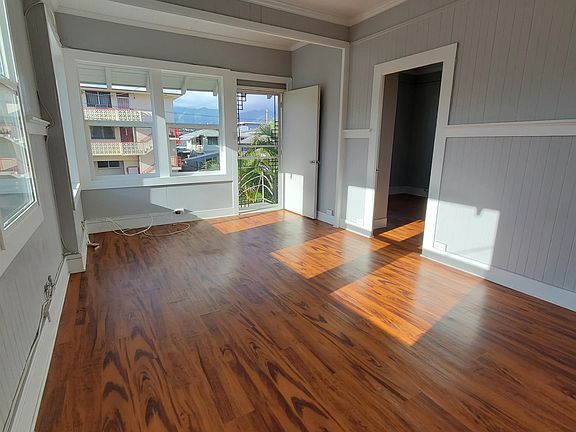 Living room with brand new windows, and security door