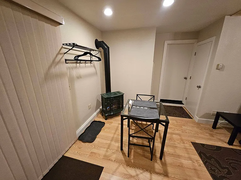 Entry slider/gas fireplace/heater; door to closet