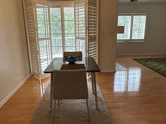 Dining area & balcony entrance with plantation shutters