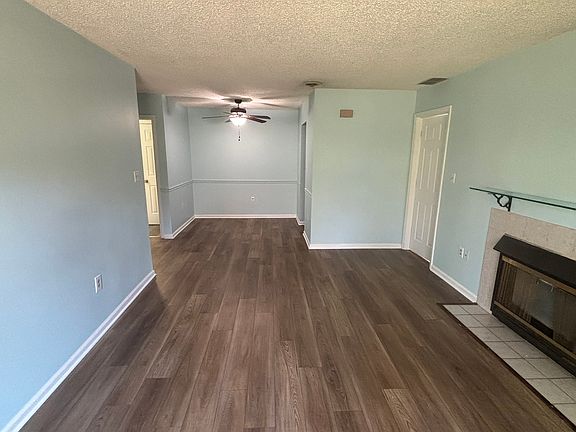 Open concept living/dining room with new laminate flooring!