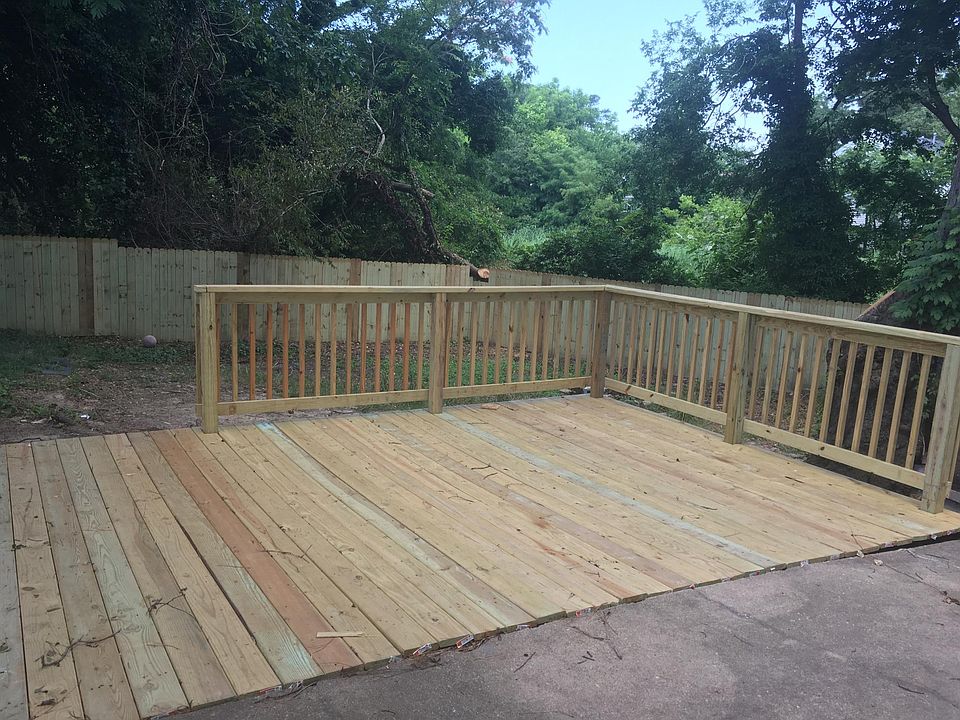 Fenced in back yard with Deck