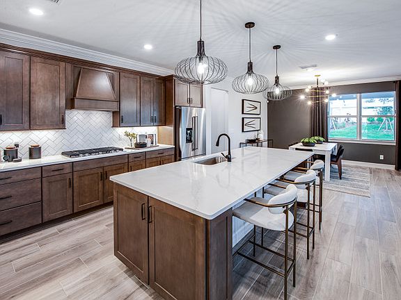 Oversized island in kitchen with designer finishes, conceptual