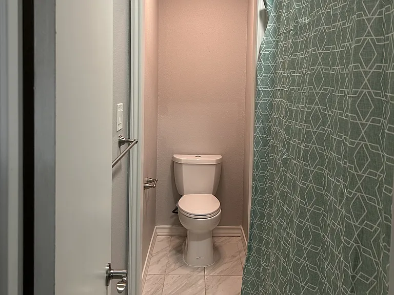 Tub/shower combo in a separate area which is a great solution when you and your significant other are getting ready at the same time.