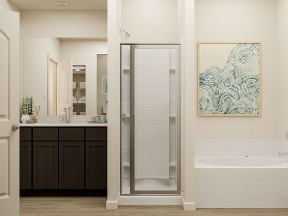 Rendering of the master bathroom, complete with a shower, soaking tub and large vanity.
