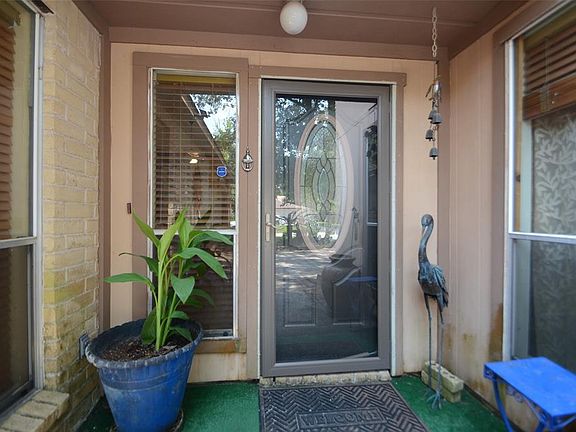 Glass door protects the wooden door, both newly installed.