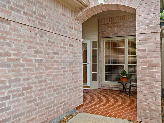 Covered patio entrance is warm and inviting.