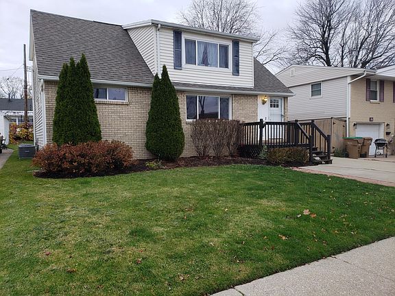 Front of house, lawn, central air