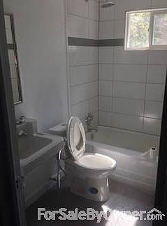 new floor and toilet
						:
						large 20x20 tiles, new dual flush toilet, antique sink with new hardware