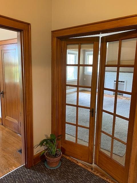 Double door View into living room from Landing. Door on left is into the Bonus Room.