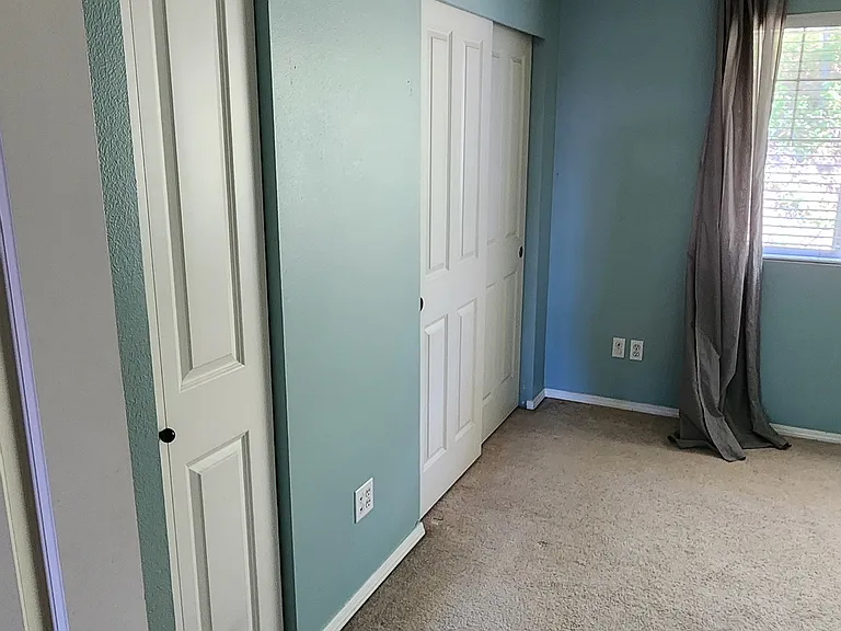 secondary bedroom with 2 large closets