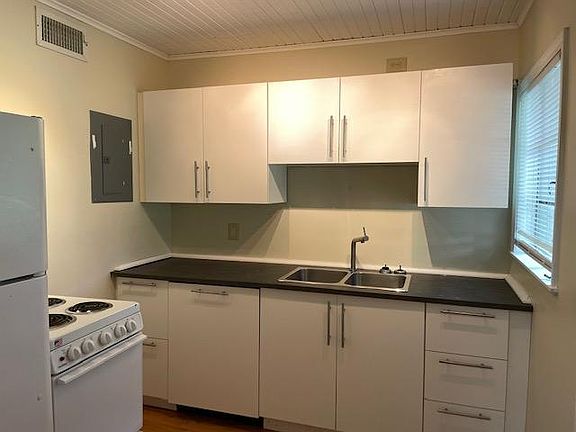 Kitchen with stove/oven, refrigerator, and dishwasher