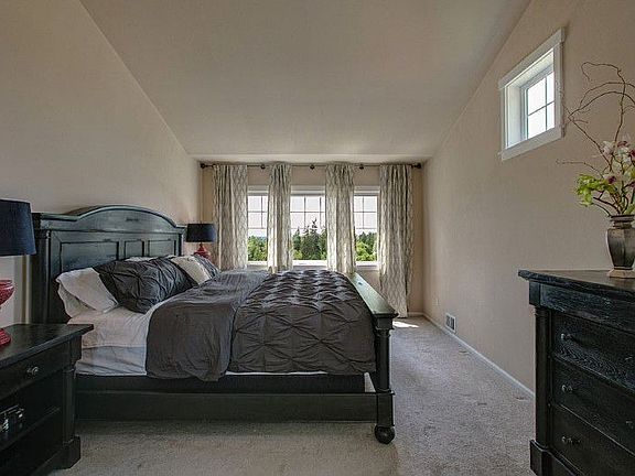 Master bedroom with vaulted ceilings.