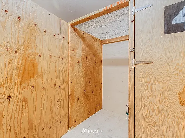 3x3x5 ft storage and/or bicycle locker located across the interior hallway from the unit.