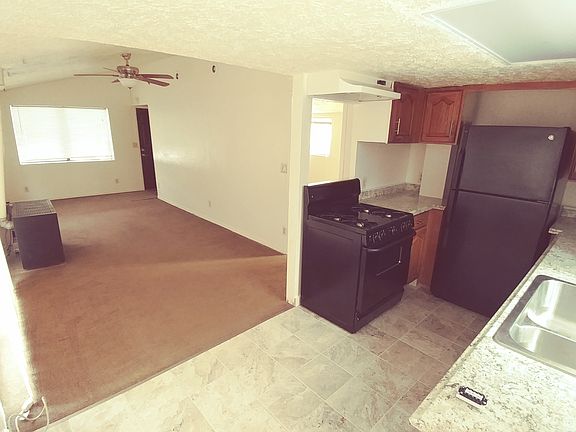 kitchen- new counters, tile floor, double pane window